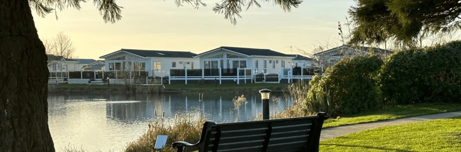 Lodges beside a lake at a UK holiday park